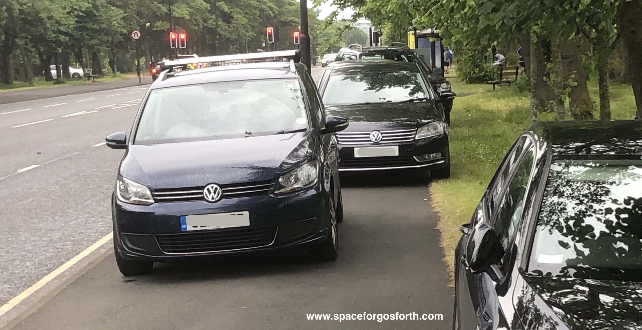 Vehicles blocking the pavement.